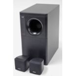 A Bose Acoustimass speaker system, with large speaker and two smaller speakers, the largest 35.5cm h