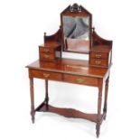 A Victorian walnut dressing table, with carved fan mirrored centre above two pedestal sections with