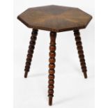 An oak gypsy table, with four diamond cut top on tripod hall legs with carved borders, 58cm high, 57