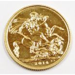 An Elizabeth II full gold sovereign, dated 2014, in plastic coin casing.