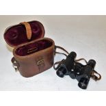 A set of Deltrex Minim binoculars, 6x24 in small brown leather carry case.