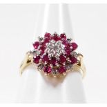 A 9ct gold dress ring, set with graduated rubies and diamonds, in a raised basket setting, ring size