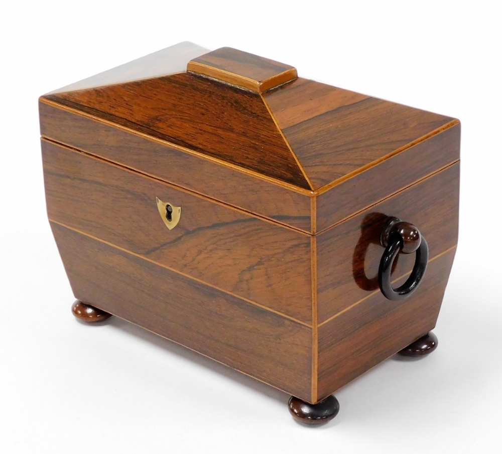 A 19thC rosewood tea caddy, with a domed top, opening to reveal two sections each with bone handle,