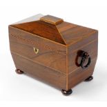A 19thC rosewood tea caddy, with a domed top, opening to reveal two sections each with bone handle,