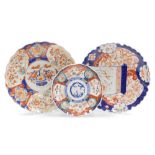 Three Japanese Imari saucer dishes, one with a flared rim and blue and orange detailed decoration, 3