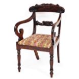 A William IV mahogany carver chair, with carved flecked back and scrolled arms on tapered supports w