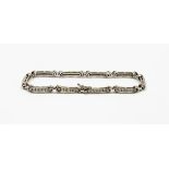 An 18ct white gold diamond line bracelet, with cross design and bars of six round brilliant cut diam