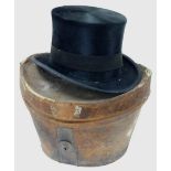 A gentlemans top hat, with black outer calf skin marked to rim, natural tanned calf in a leather car