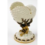 A Royal Worcester shell vase, the moulded cornucopia shell top on a flared tree type stem with gilt