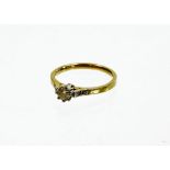 An 18ct gold diamond dress ring, with round brilliant cut diamond in claw platinum setting, 4.2mm x
