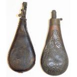 Two leather powder flasks, each leather, one with greyhound and tree emblems, with contents, and ano