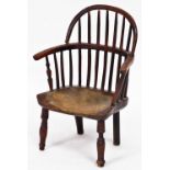 A 19thC child's Windsor chair, yew, ash and elm, with turned legs 54cm high, 43cm wide and 26cm deep