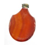 A red agate scent bottle with gilt coloured seal stamp, 6cm high.