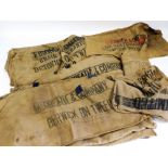 A large group of Hessian advertising sacks.