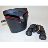 A cased set of Asahi Pentax binoculars, in black leather carry case.