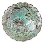An early 20thC Chinese bronze plate, depicting tiger and dragons, heavily patinated green finish, 23