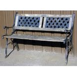 A cast iron and wooden slatted garden bench, with pierced slat with plaque Steven Joyce Mum and Dad,