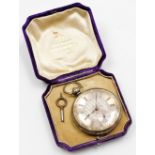 A pocket watch, with heavy elaborate silver coloured dial, and outer gilt scroll detailing, with Rom