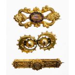 Three various brooches, to include a filigree detailed bar brooch in Victorian style, 4cm wide, yell