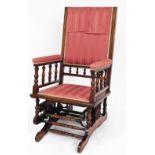 An American rocking chair, with later upholstered pink striped material, with walnut beading, 107cm