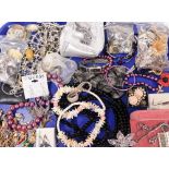 A group of various costume jewellery, diamante set necklaces, a modern art brooch, possibly silver,