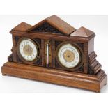 A late Victorian oak aneroid barometer and clock, in architectural case, with fret work cornice abov