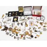 A group of costume jewellery, to include dress rings, loose coinage, decorative brooches, gold plate