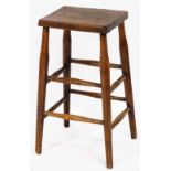 A rustic elm stool, with two panelled leg supports on tapered legs, 61cm high.