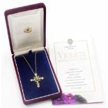 A House of Faberge Violets in the Snow cross pendant and chain, the cross set with amethyst and emer