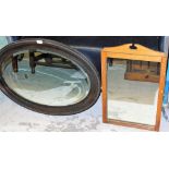 Two mirrors, to include an oak oval wall mirror and a pine framed dressing table mirror. (2)