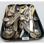 A group of silver plated cutlery, shell spoons, bone handled knives, etc. (1 tray)