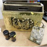 A silver plated cruet set, pair of Field and Mark army binoculars and a copper magazine rack. (3)