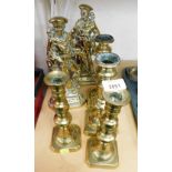 A group of Victorian brass candlesticks and ornaments, to include two pairs of brass candlesticks, a