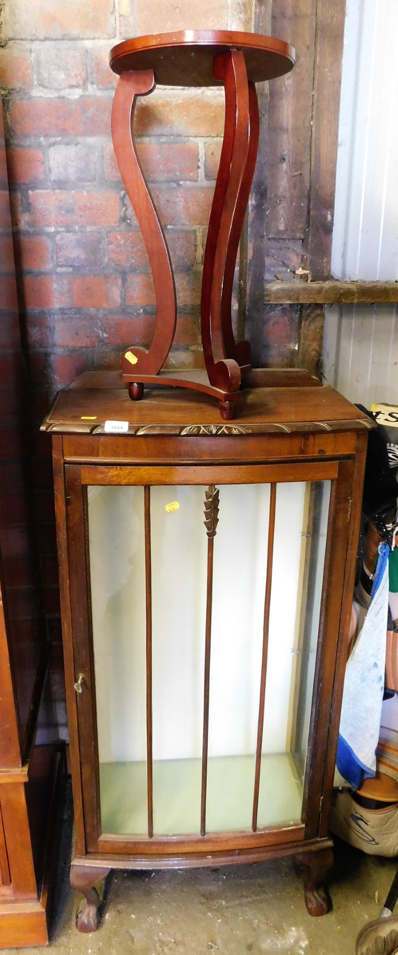 A small group of furniture, to include a half circular side table, and a cocktail cabinet.