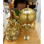 A group of brassware, to include egg cups and spoons, trivet stand, teapot, bell, etc. (a quantity)