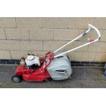 An Asper petrol lawnmower.