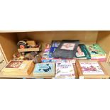 Various toys and games, Fuzzy Felt pets, Scrabble, jigsaws, Monopoly, wooden tractor and car, wooden