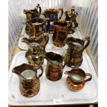 A group of copper lustre jugs. (2 trays)