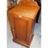 A late 19thC walnut pot cupboard, with carved back on single door.
