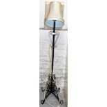 A cast metal standard lamp with shade.