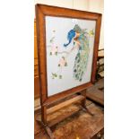 A peacock embroidered fire screen come table.
