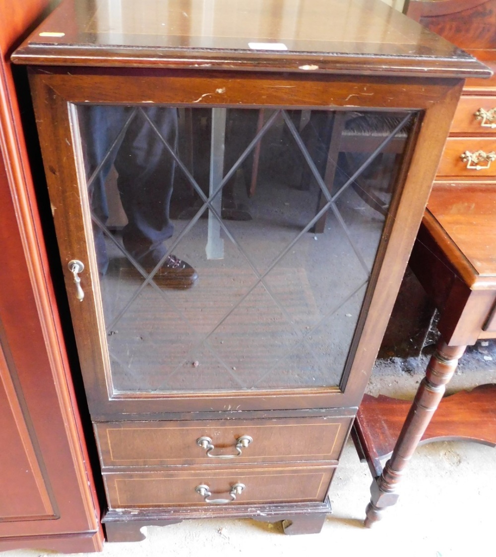 A mahogany finish glazed cabinet with two drawers.