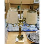 A brass four branch table lamp, with shades.