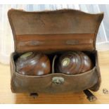 A cased set of two bowls, in leather travel case.