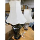Two ceramic table lamps, each with cream shade.