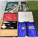 A group of silver plated cutlery, sugar tongs, knives, novelty cork screw, etc. (1 tray)