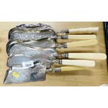 Six bone handled and silver plated crumb scoops, some with berry and floral design, the other with s