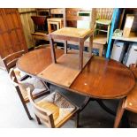 A set of five oak and rush seated dining chairs, and a reproduction twin pedestal dining table.