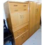 An oak G-Plan E Gomme bedroom suite, to include a double wardrobe, and two chest of drawers, each wi