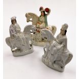 Three 19thC Staffordshire flat back figures, to include a pair of figures on horseback, 24cm high, a